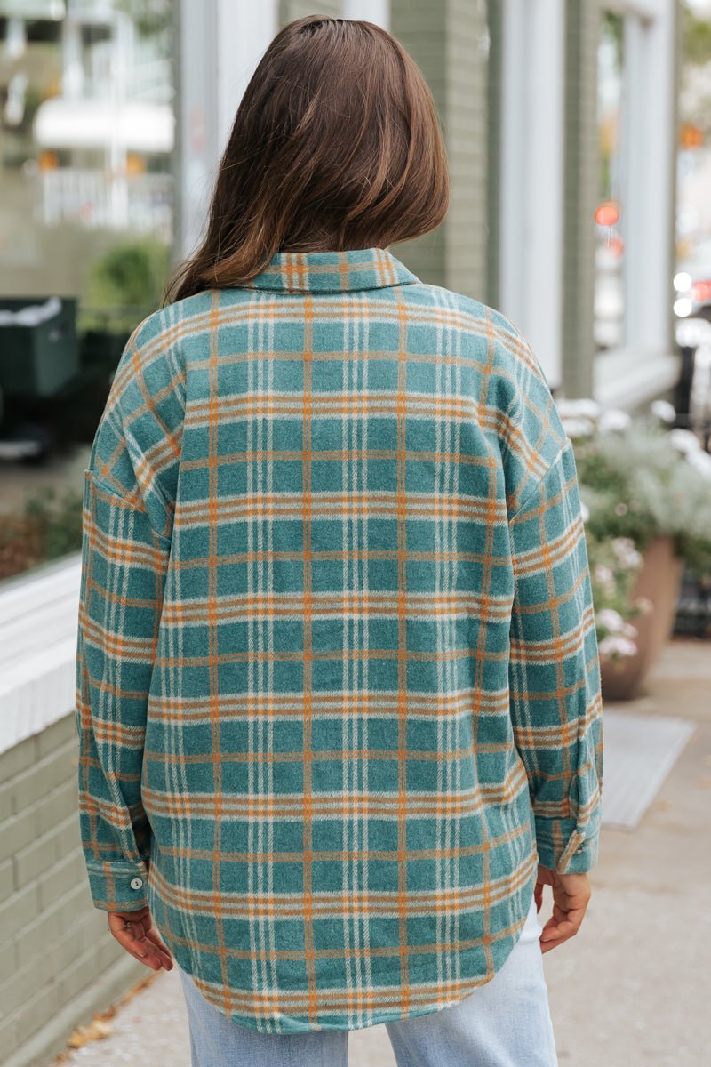 Veste à carreaux verte et orange
